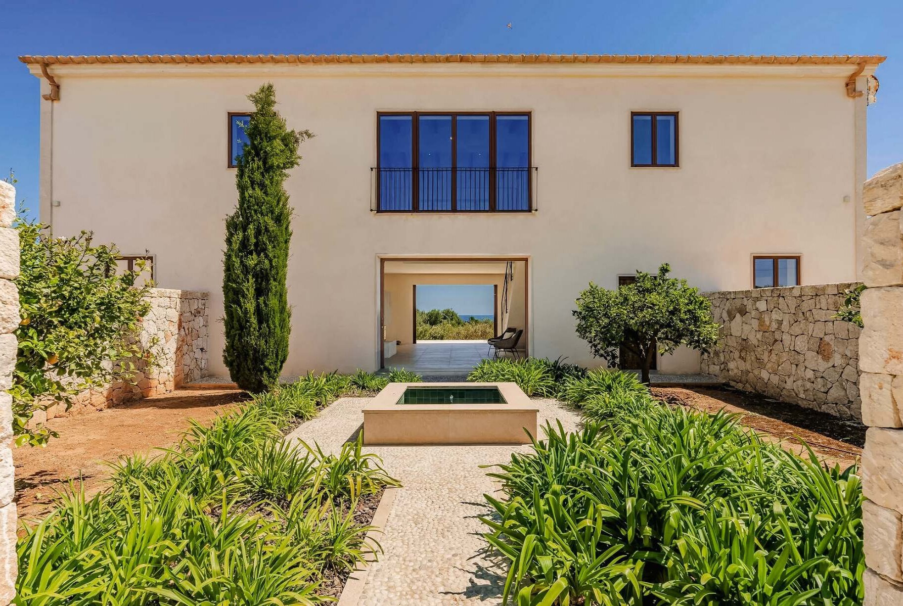 Lucera, Cala Llombards, Mallorca – heated infinity pool set into the Mediterranean garden
