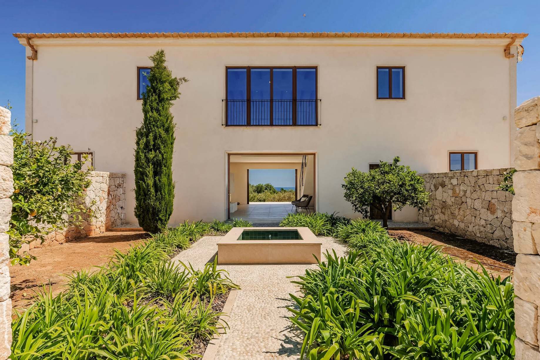 Lucera 04 Lucera, Cala Llombards, Mallorca – heated infinity pool set into the Mediterranean garden