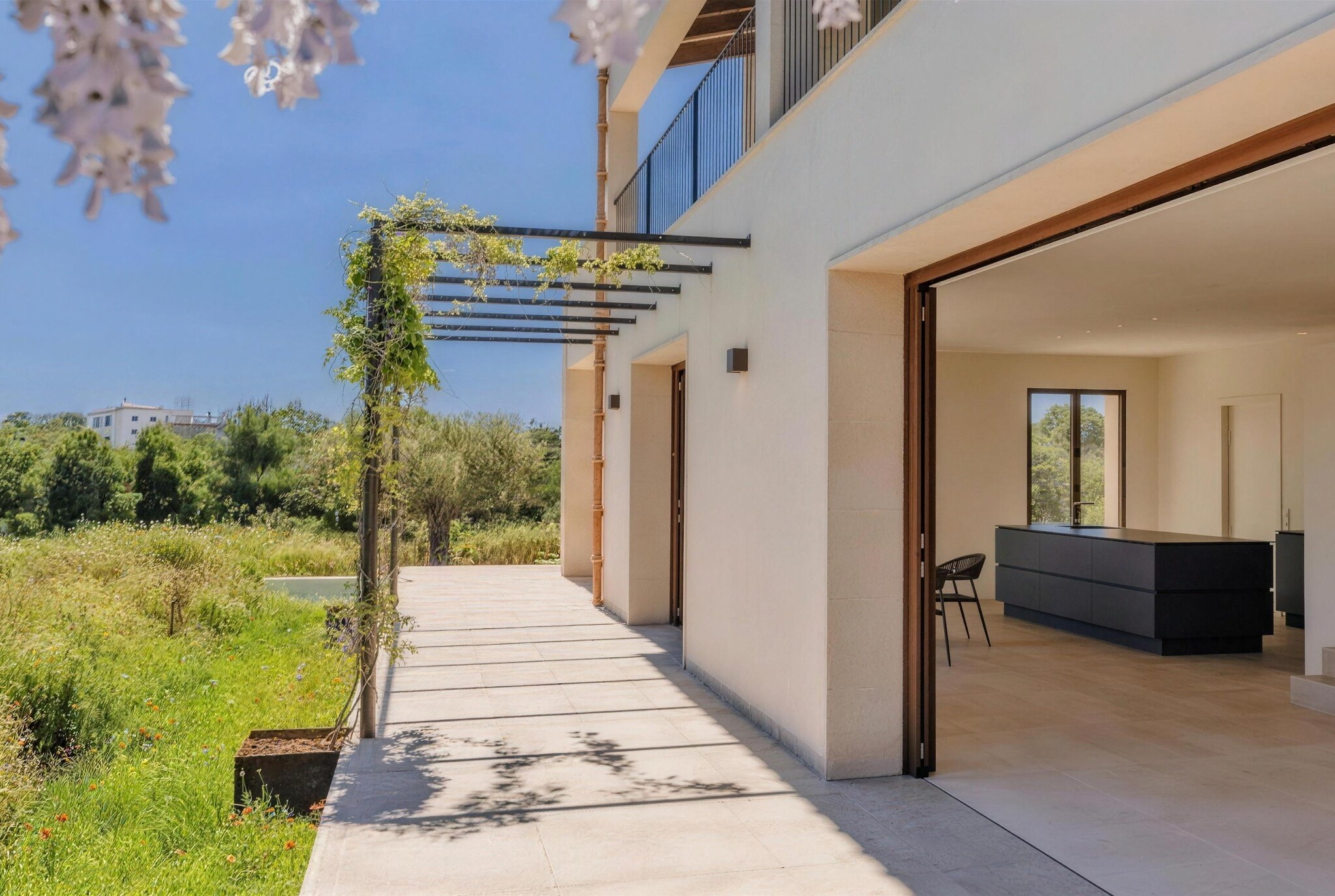 Lucera, Cala Llombards, Mallorca – dining area with glass fronts opening to the terrace