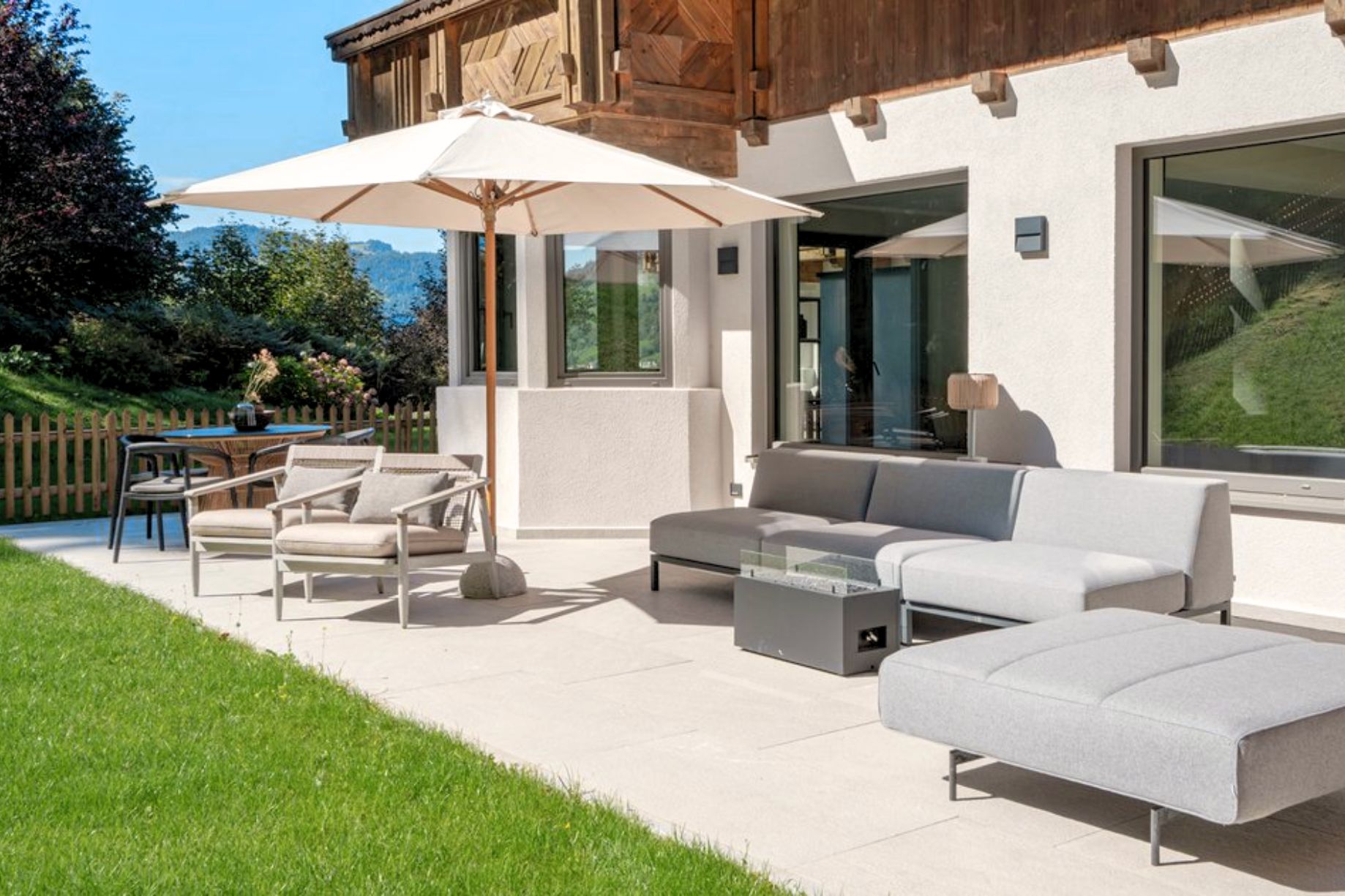 chalet-brixental-at0631a-02-1 Chalet Niederau — sunny terrace with lounge seating and mountain views